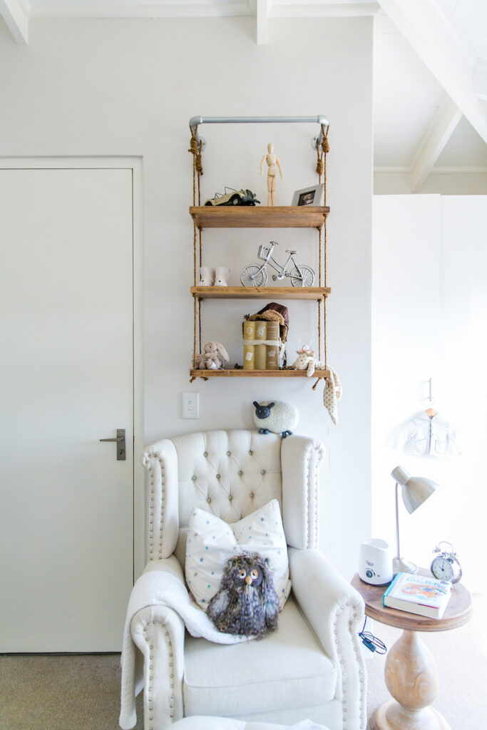 Sebastian Rope Shelf styled above a tufted nursery armchair in Baby Belle founder Pascale Cilliers’ reading nook